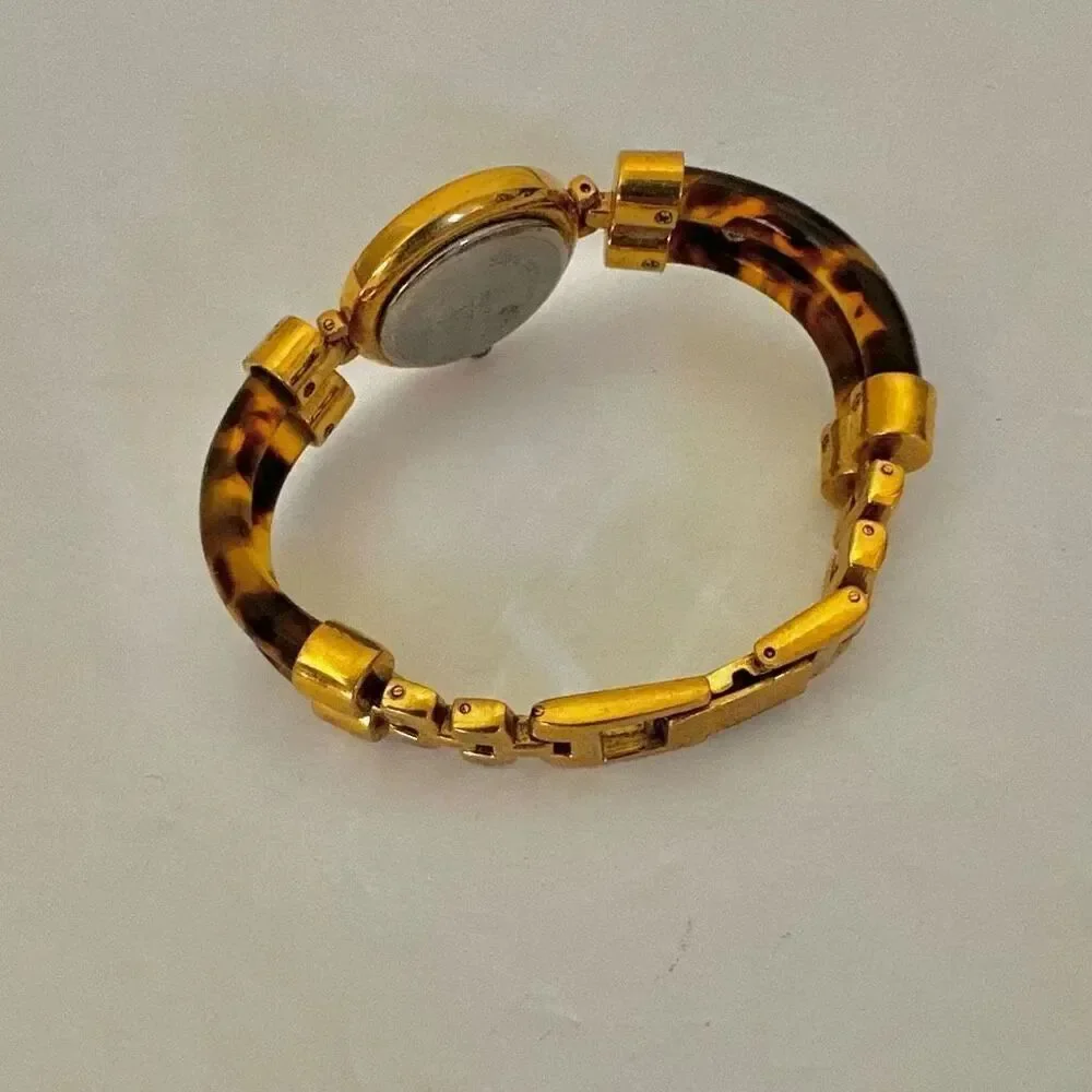 Avon faux tortoise vintage watch/ bracelet.